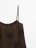 Flowing textured top with embroidered detail