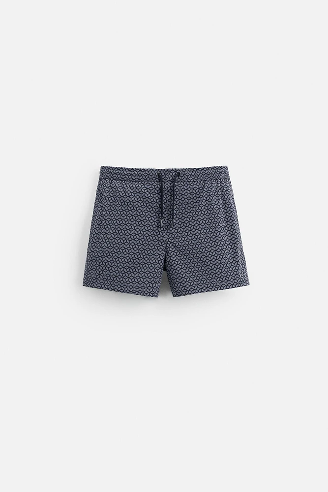 GEOMETRIC PRINT SHORT SWIMMING TRUNKS