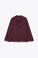 TIE-BACK RUFFLED CAPE