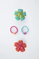 LOT DE QUATRE BAGUES FLEURS FANTAISIE