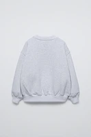 TEXT PRINT FLOCKED SWEATSHIRT