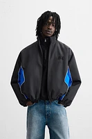 BLOUSON TECHNIQUE AVEC BLOCS DE COULEUR