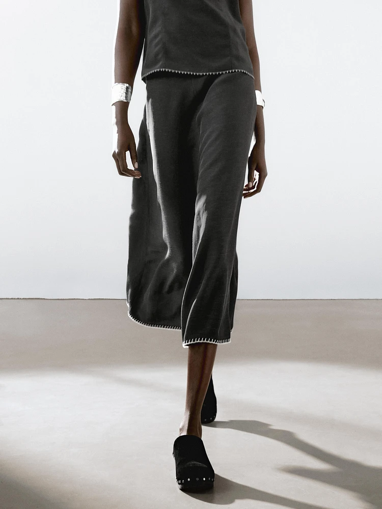 Midi skirt with topstitching detail on the hem