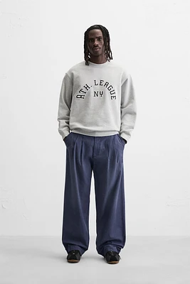 JEAN RELAXED FIT À PLIS