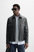 BLOUSON EN CUIR SYNTHÉTIQUE À POCHES