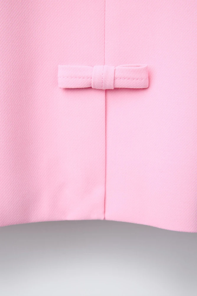 VESTE COURTE À NŒUDS