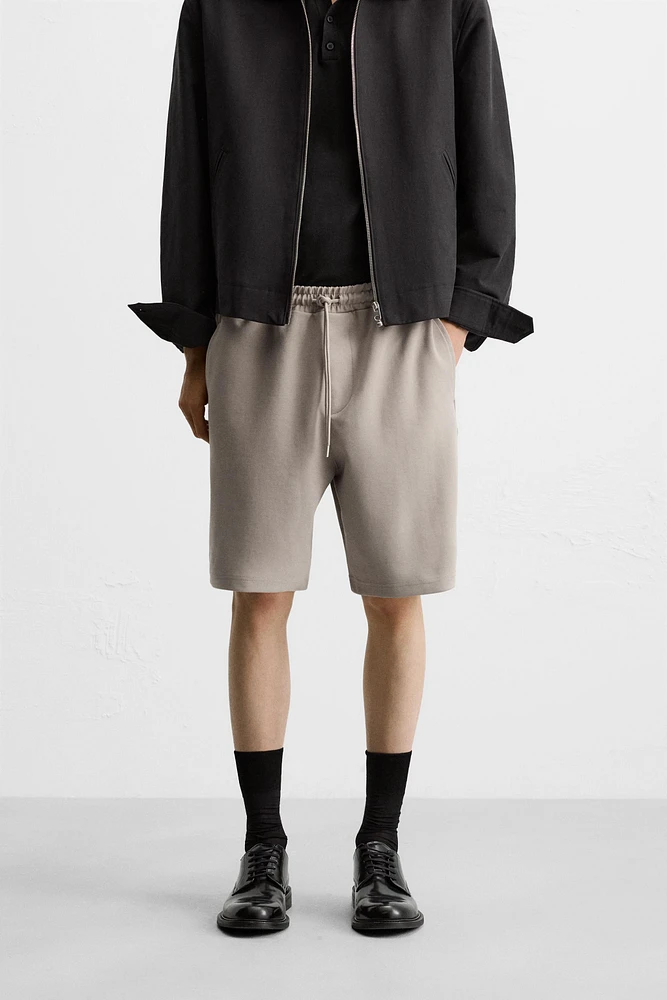 BERMUDA DE JOGGING OVERSIZE TECHNIQUE
