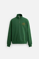 EMBROIDERED QUARTER-ZIP SWEATSHIRT