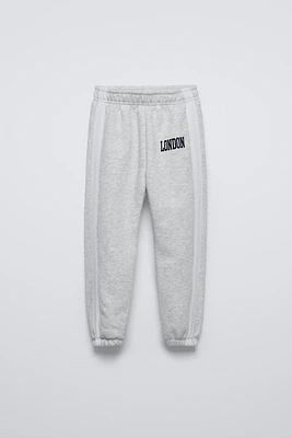 FLOCKED TEXT JOGGING PANTS