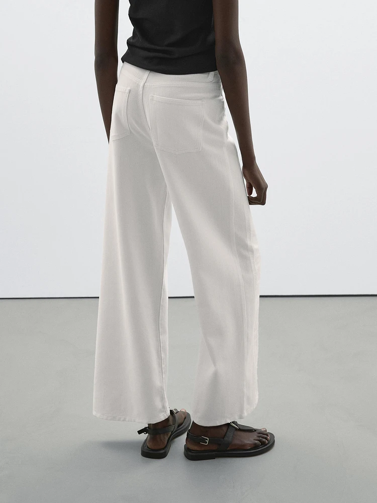 Jean wide leg taille haute avec découpes