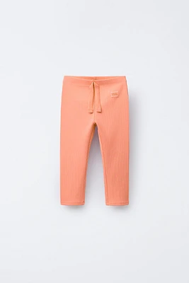 LABEL TRIM RIBBED LEGGINGS