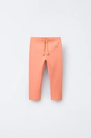LABEL TRIM RIBBED LEGGINGS