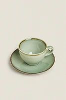 PORCELAIN TEACUP WITH ANTIQUE FINISH RIM