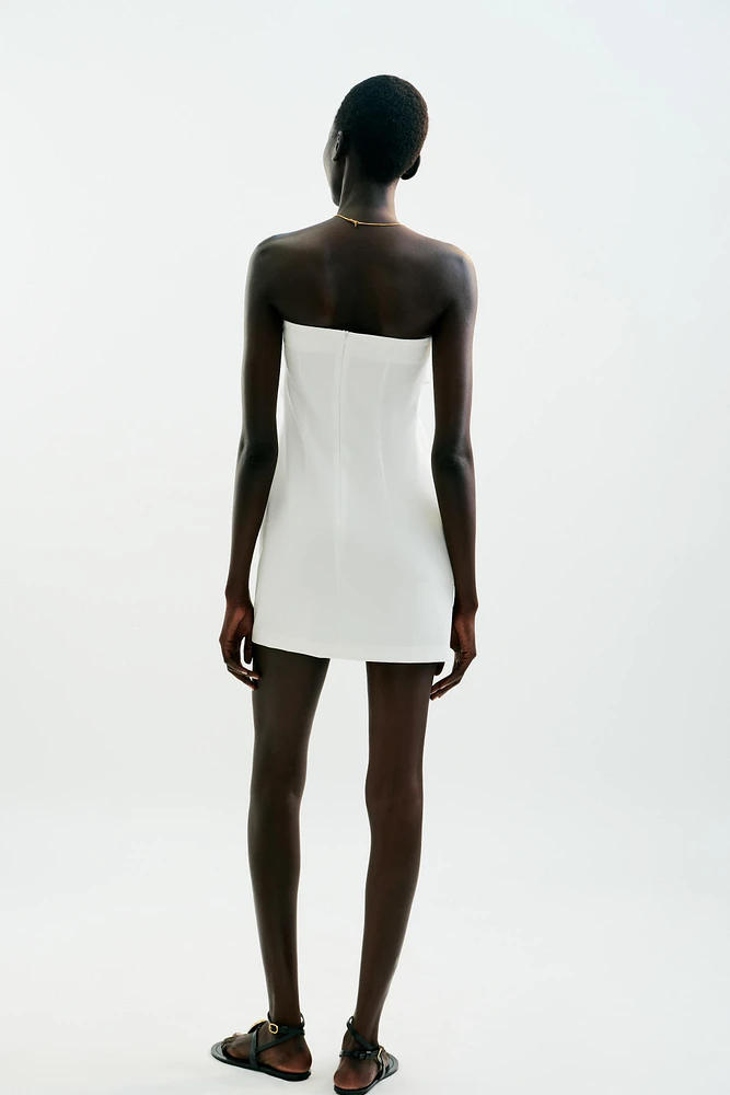 ROBE COURTE NŒUD DÉCOR DORÉ