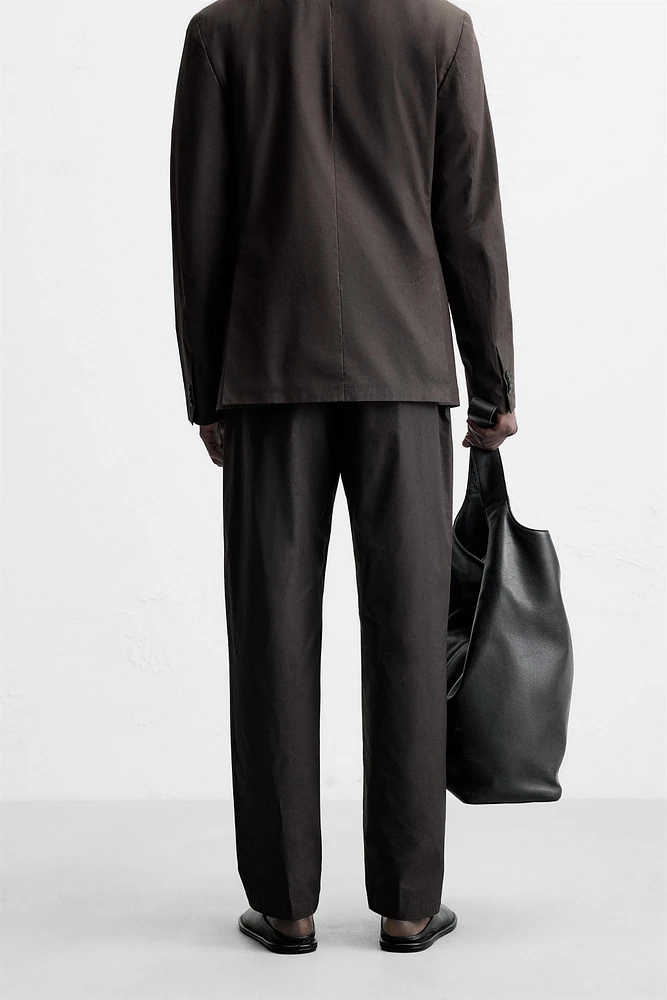 WAXED EFFECT SUIT PANTS
