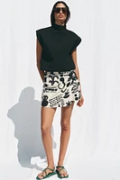 MINI-JUPE IMPRIMÉE BOUCLE