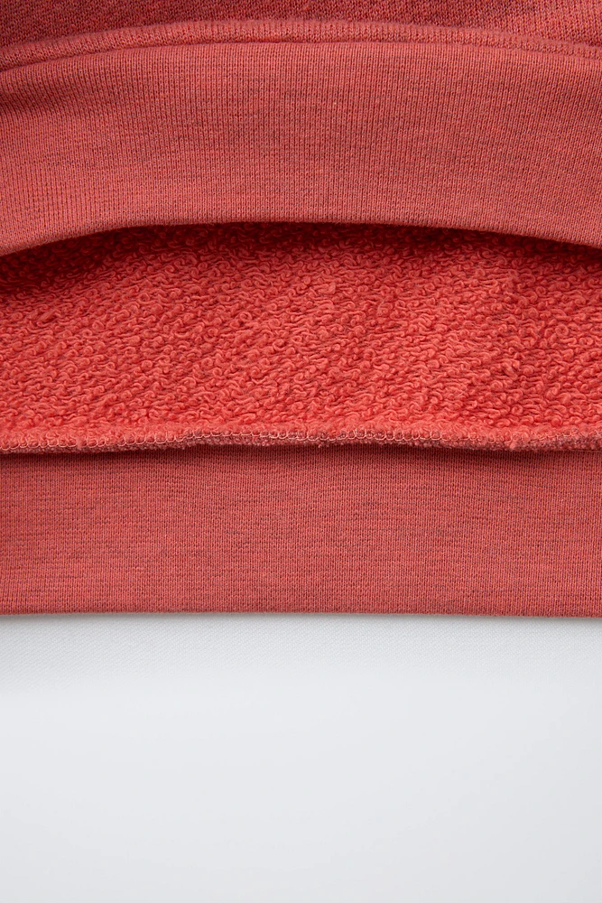SWEAT EFFET DÉLAVÉ À INSCRIPTION IMPRIMÉE