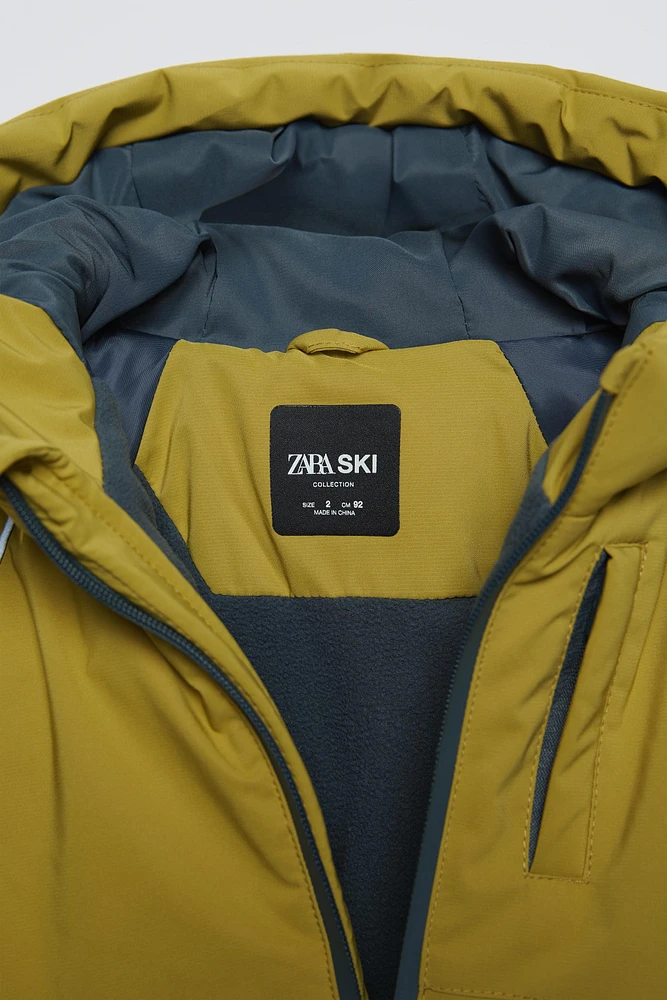 VESTE À CAPUCHE DÉPERLANTE ET COUPE-VENT COLLECTION SKI