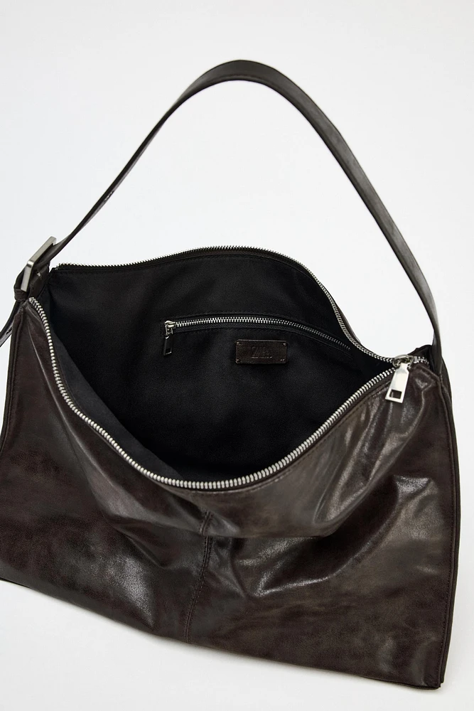 LARGE SOFT BUCKET BAG WITH METAL EYELETS