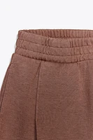 WASHED PLEATED PANTS