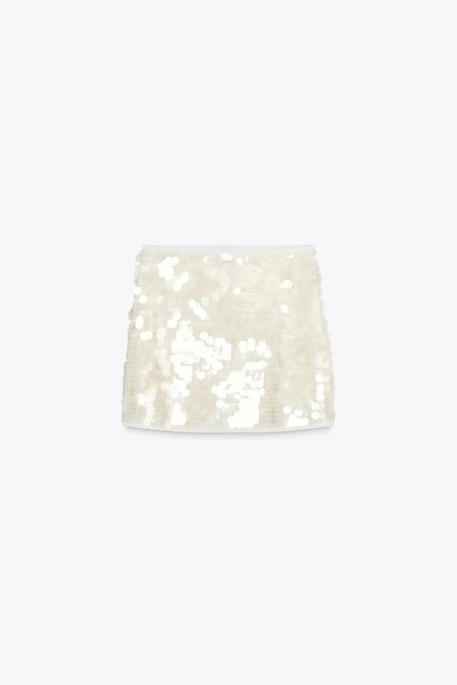 MINI-JUPE EN MAILLE À SEQUINS