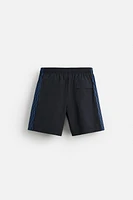 MAILLOT DE BAIN LONG À BANDES CARREAUX
