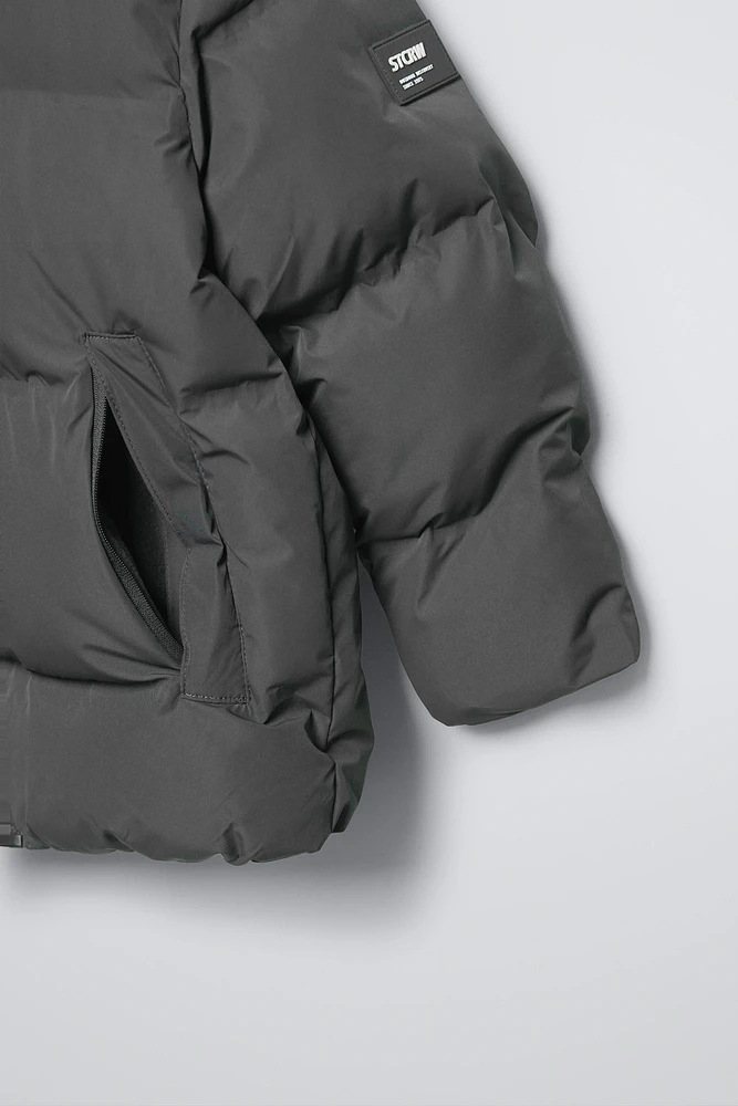 MANTEAU DÉPERLANT ÉTIQUETTE