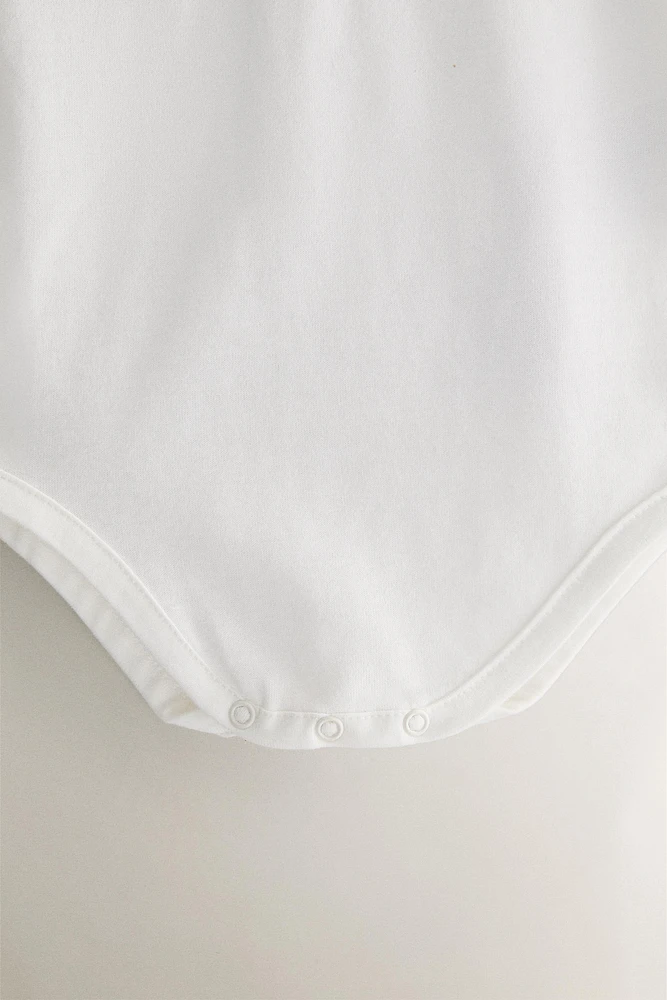 BAVOIR ENFANT BRODERIE FLEURS