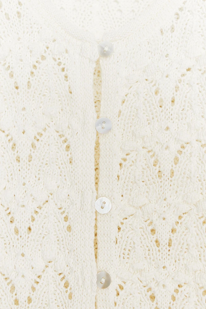 TOP ROMANTIQUE EN MAILLE MATIÈRES VARIÉES