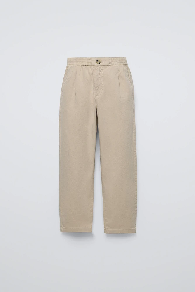 PLEATED TAPERED PANTS