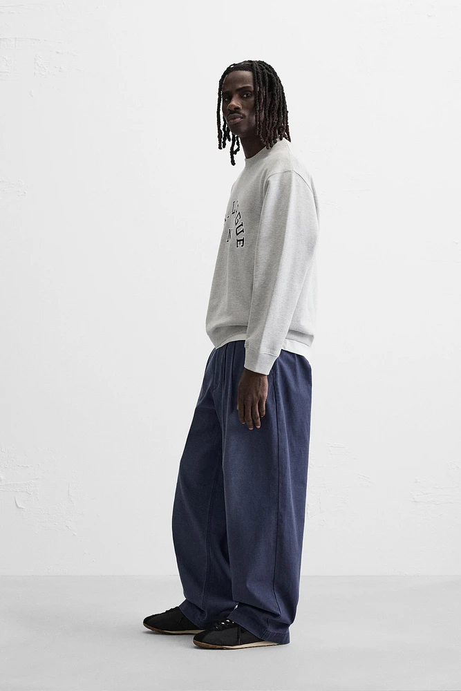 RELAXED FIT PLEATED PANTS