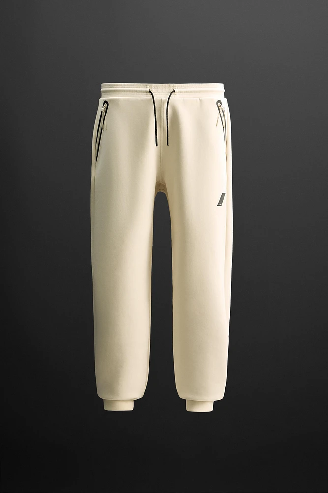 TECHNICAL ZIPPER JOGGER PANTS
