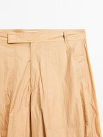 Lightweight trousers with strap details - Studio