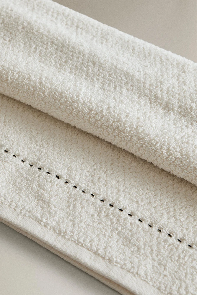 SERVIETTE DE BAIN POINT RIZ SURPIQÛRE