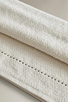 SERVIETTE DE BAIN POINT RIZ SURPIQÛRE