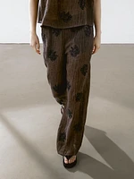 Flowing textured top with embroidered detail