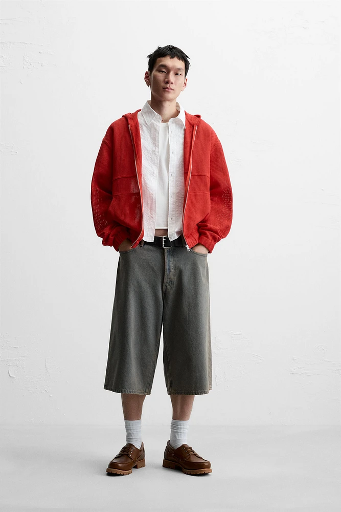 VESTE STRUCTURE OUVERTE CAPUCHE
