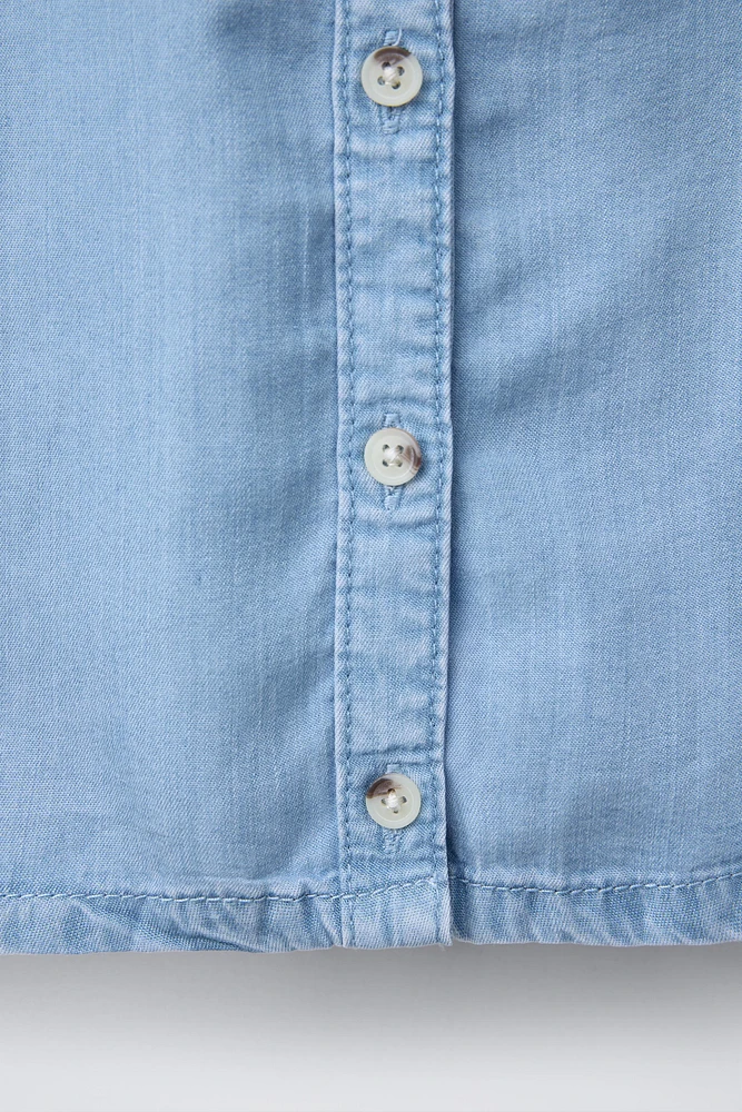 FLOWY RUFFLED DENIM BLOUSE
