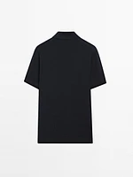 Polo en maille de coton à col zippé