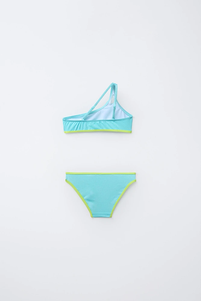 6-14 ANS/ MAILLOT DE BAIN ASYMÉTRIQUE BRILLANT LISERÉS