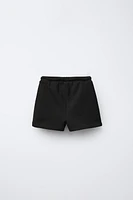 EMBROIDERED PLUSH SHORTS