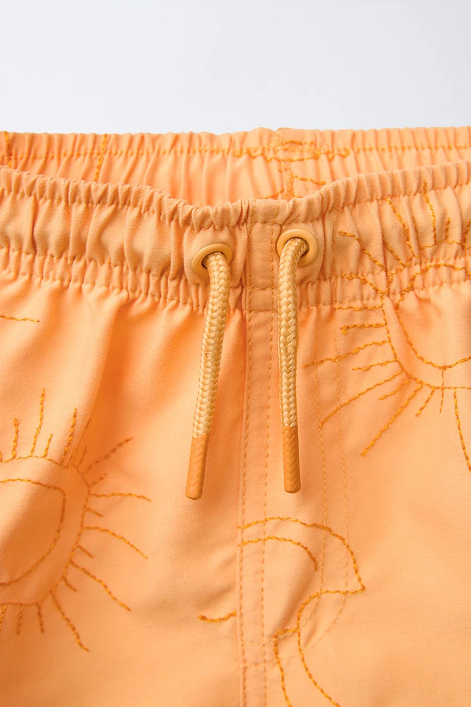 6-14 ANS/ SHORT DE BAIN SOLEILS BRODÉS