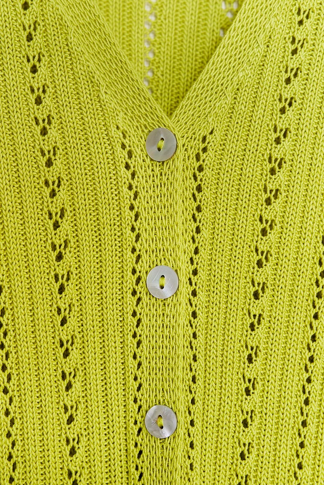 GILET EN MAILLE POINTELLE À VOLANTS