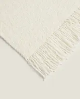 BOUCLÉ BLANKET WITH FRINGING