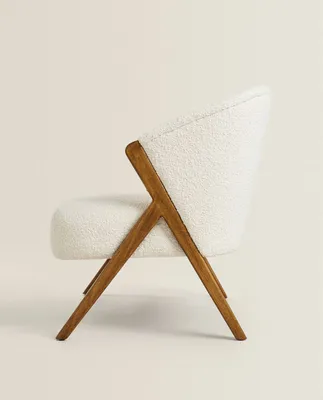 UPHOLSTERED BOUCLÉ ARMCHAIR