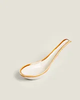 PORCELAIN SPOON WITH ANTIQUE-FINISH RIM