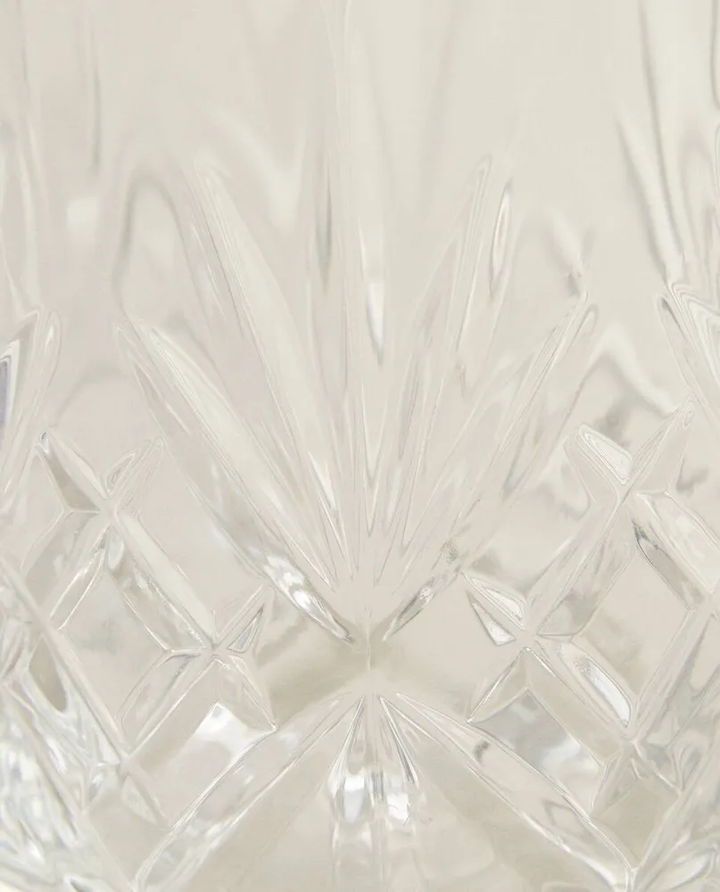 CRYSTALLINE TUMBLER WITH RAISED DESIGN