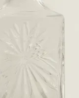 CRYSTALLINE BOTTLE WITH RAISED DESIGN