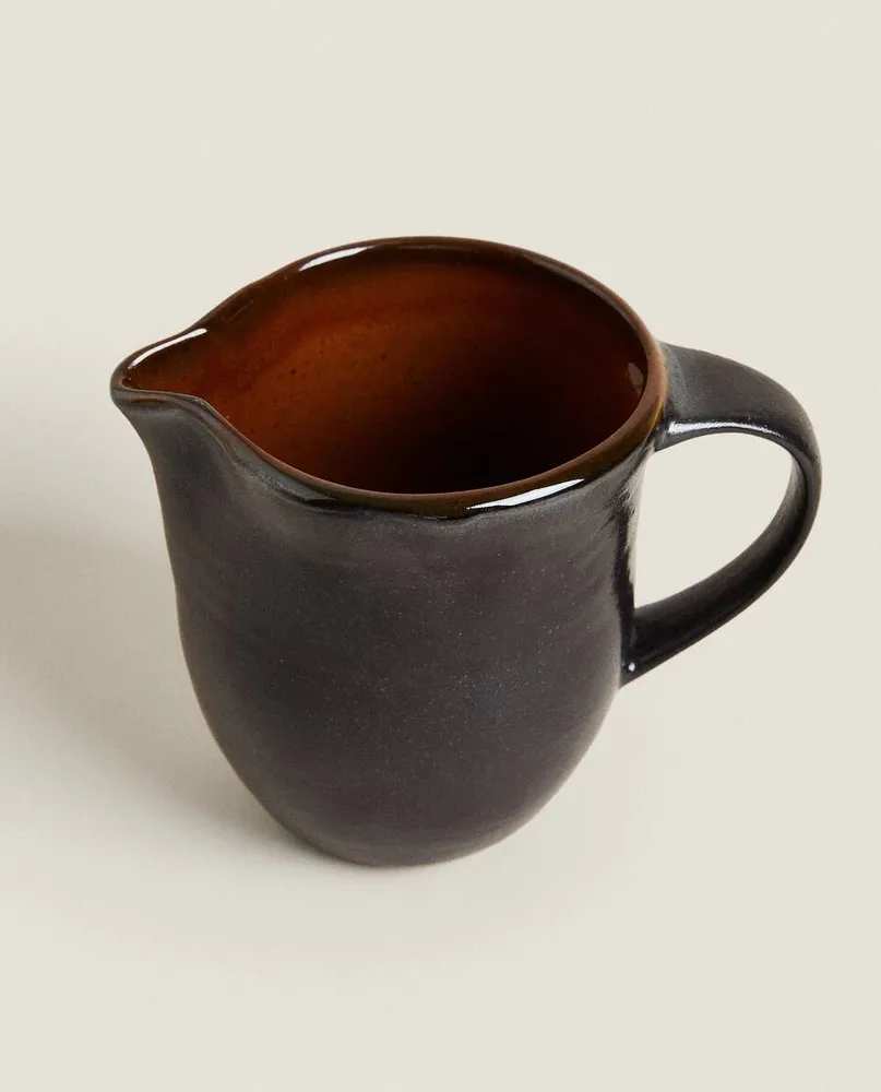 STONEWARE JUG WITH HANDLE