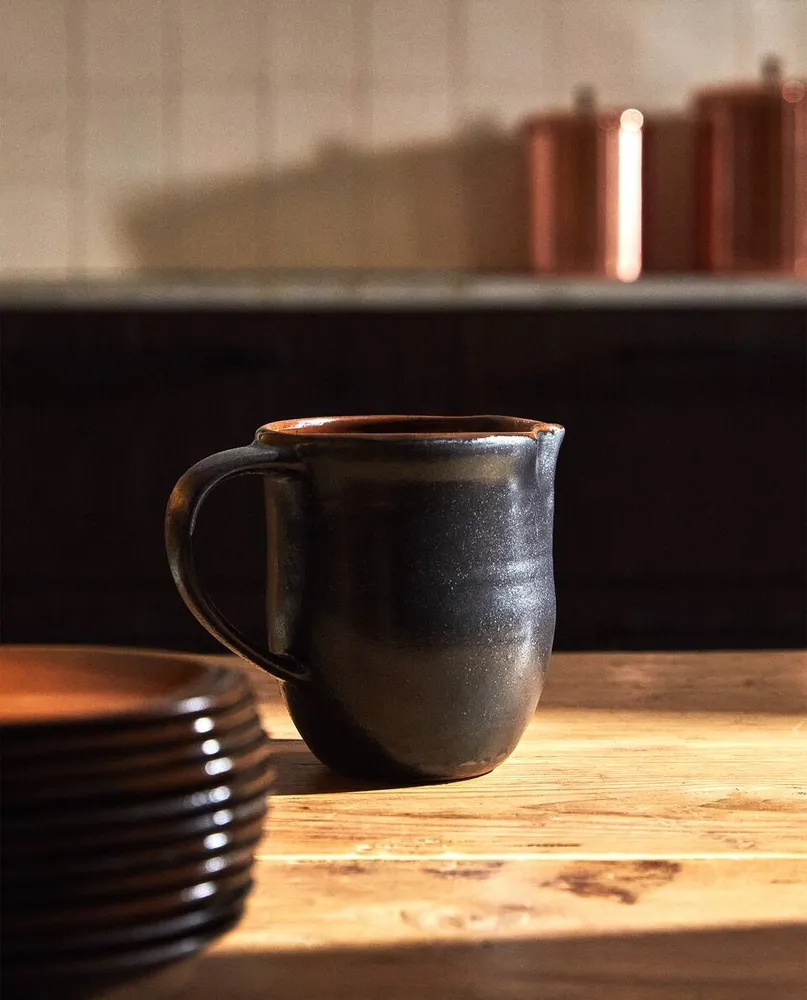 STONEWARE JUG WITH HANDLE